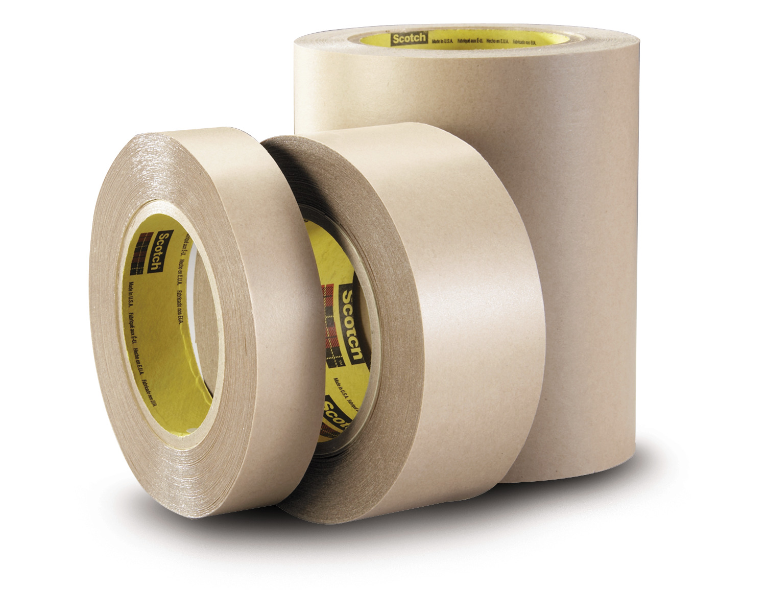 3 tan rolls of Tape against white background
