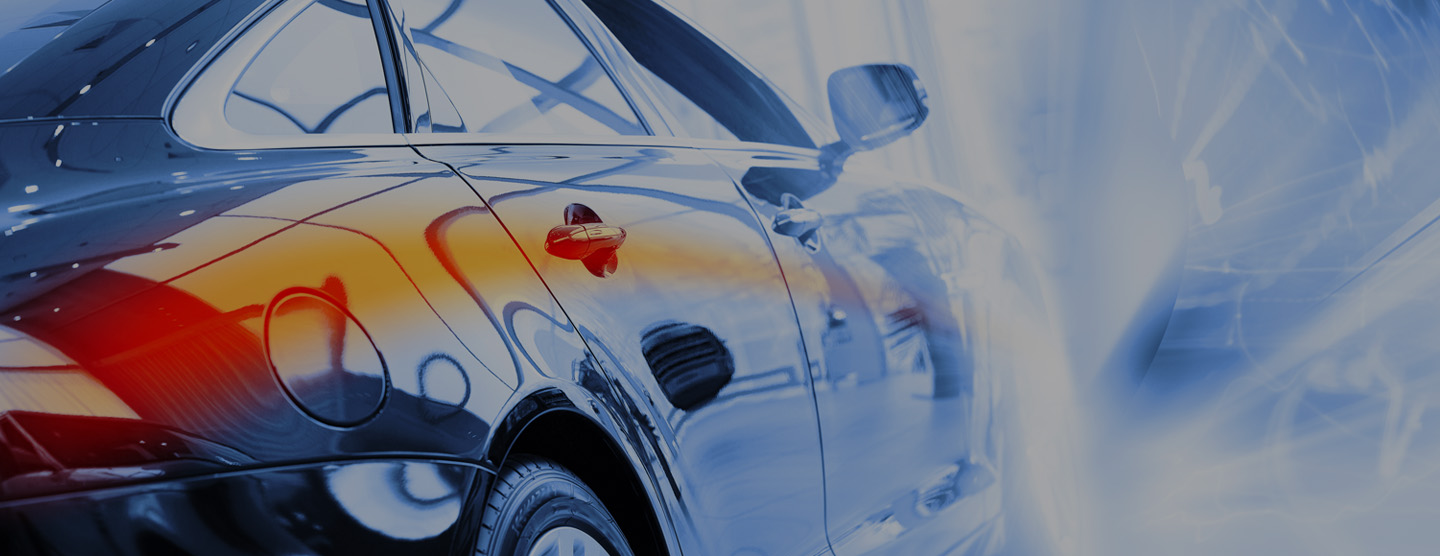 side profile of a car surrounded by beams of light