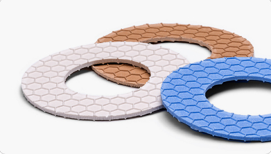 washers in blue, light pink, and orange from gasket sheet material