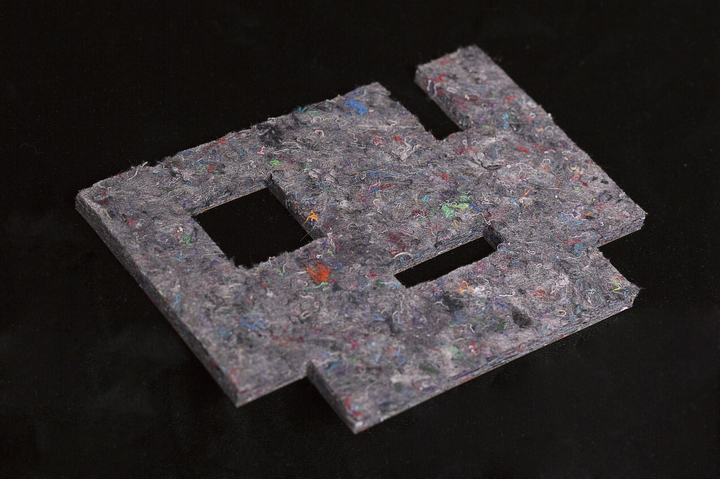 mixed materials in a variety of shapes scattered across a black background