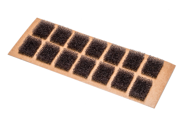 charcoal open cell foam cut into squares with adhesive on backing