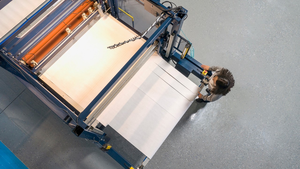 Laser machine cutting into board